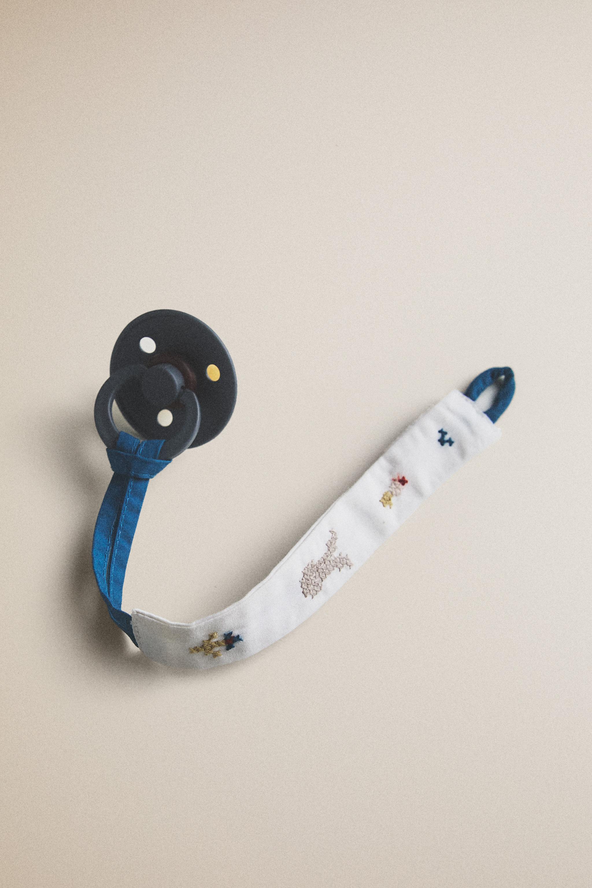 ATTACHE-SUCETTE LAPINS