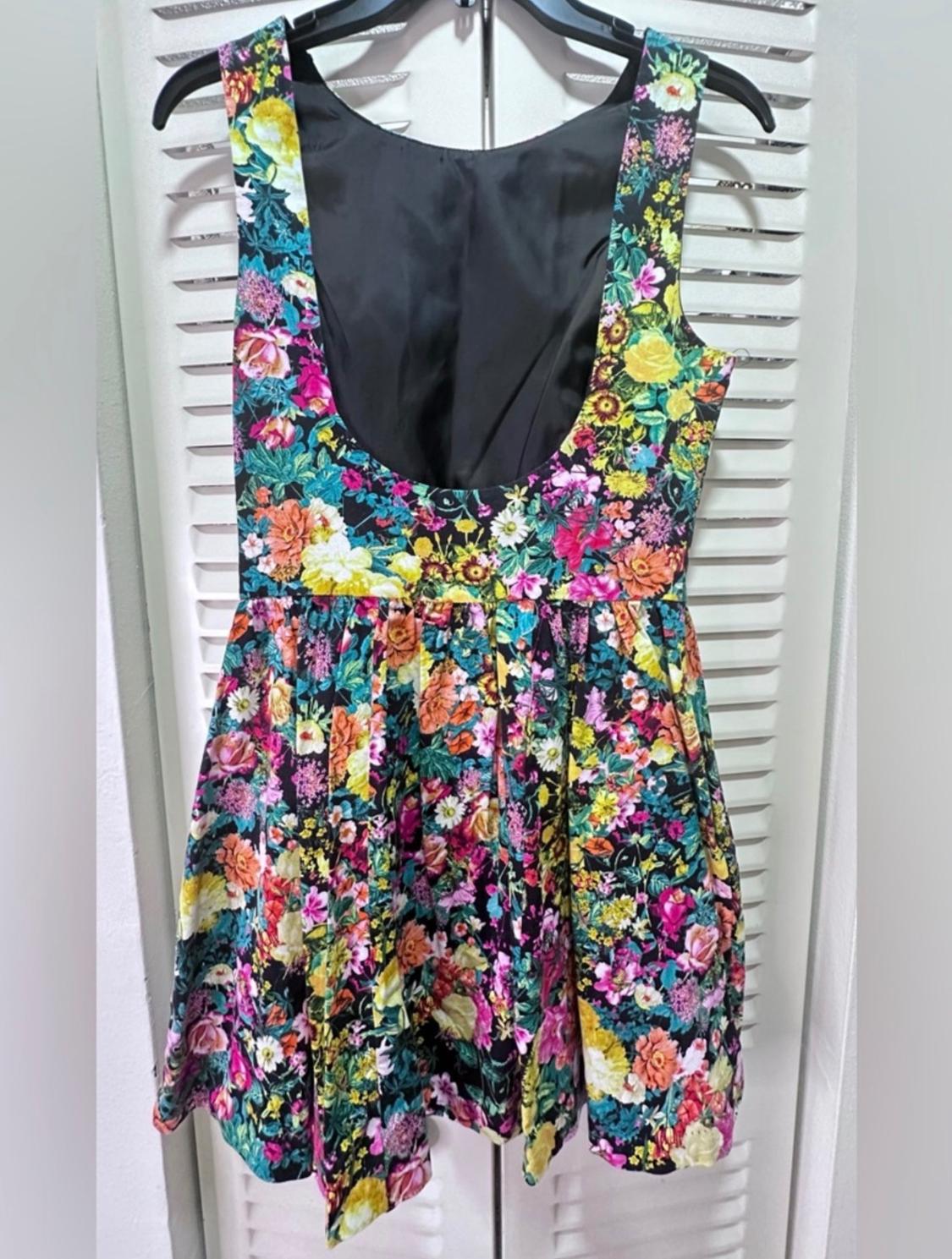 MINI FLORAL FIT AND FLARE DRESS IN BLACK WITH YELLOW, PINK AND TEAL FLOWERS. - Image 2