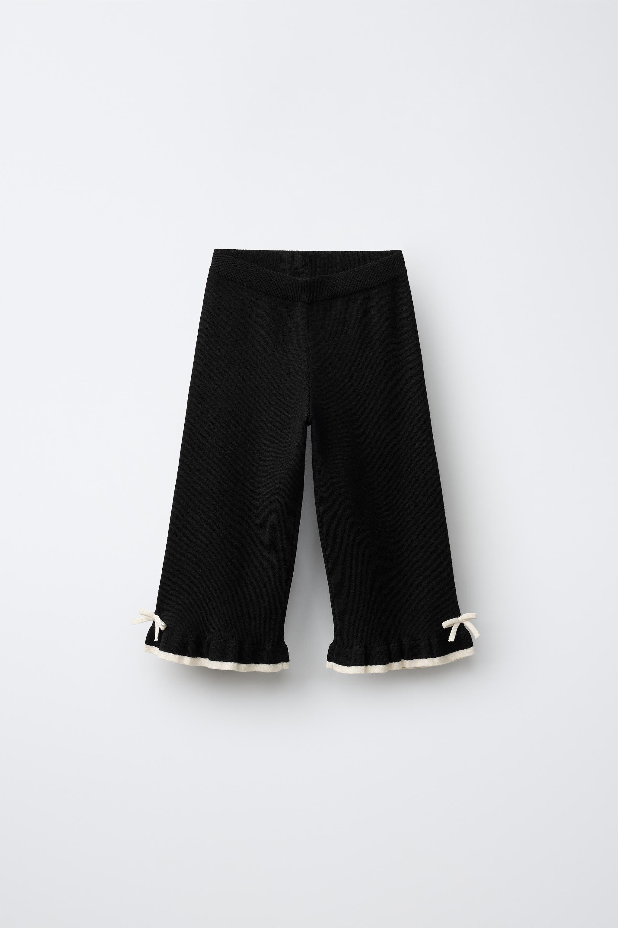 PANTALON EN MAILLE FLARE AVEC LACETS ET VOLANT