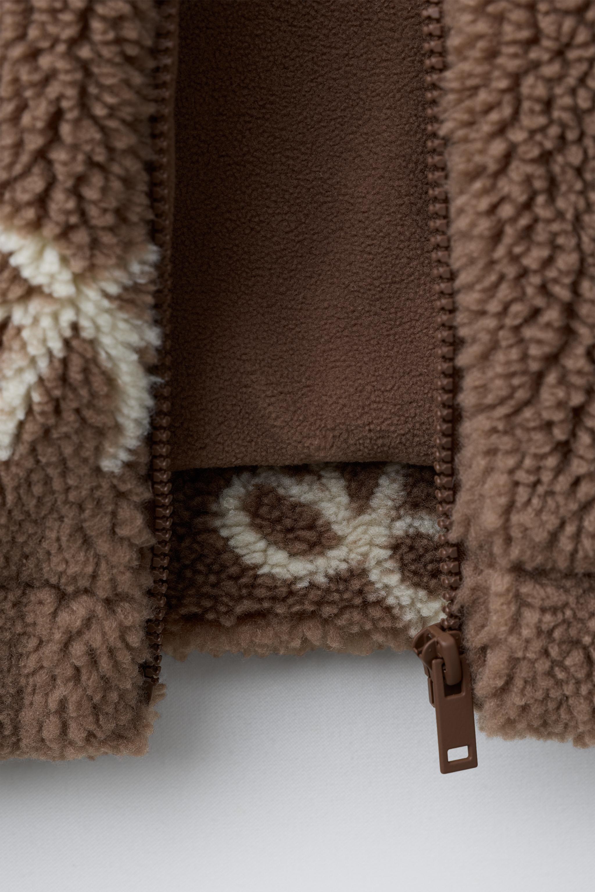 FAUX SHEARLING JACKET WITH BOW PRINT