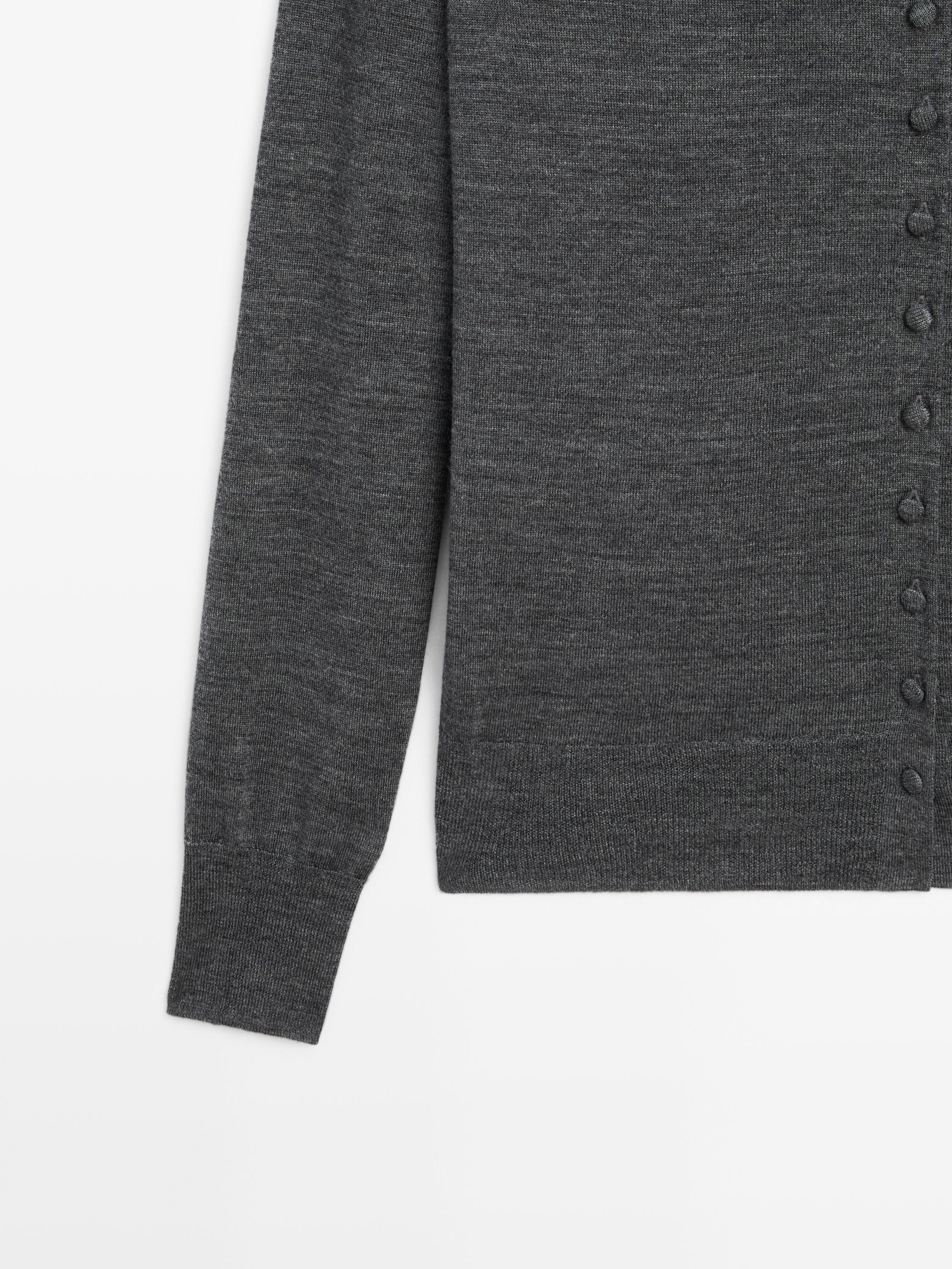 Mock turtleneck cardigan with covered buttons