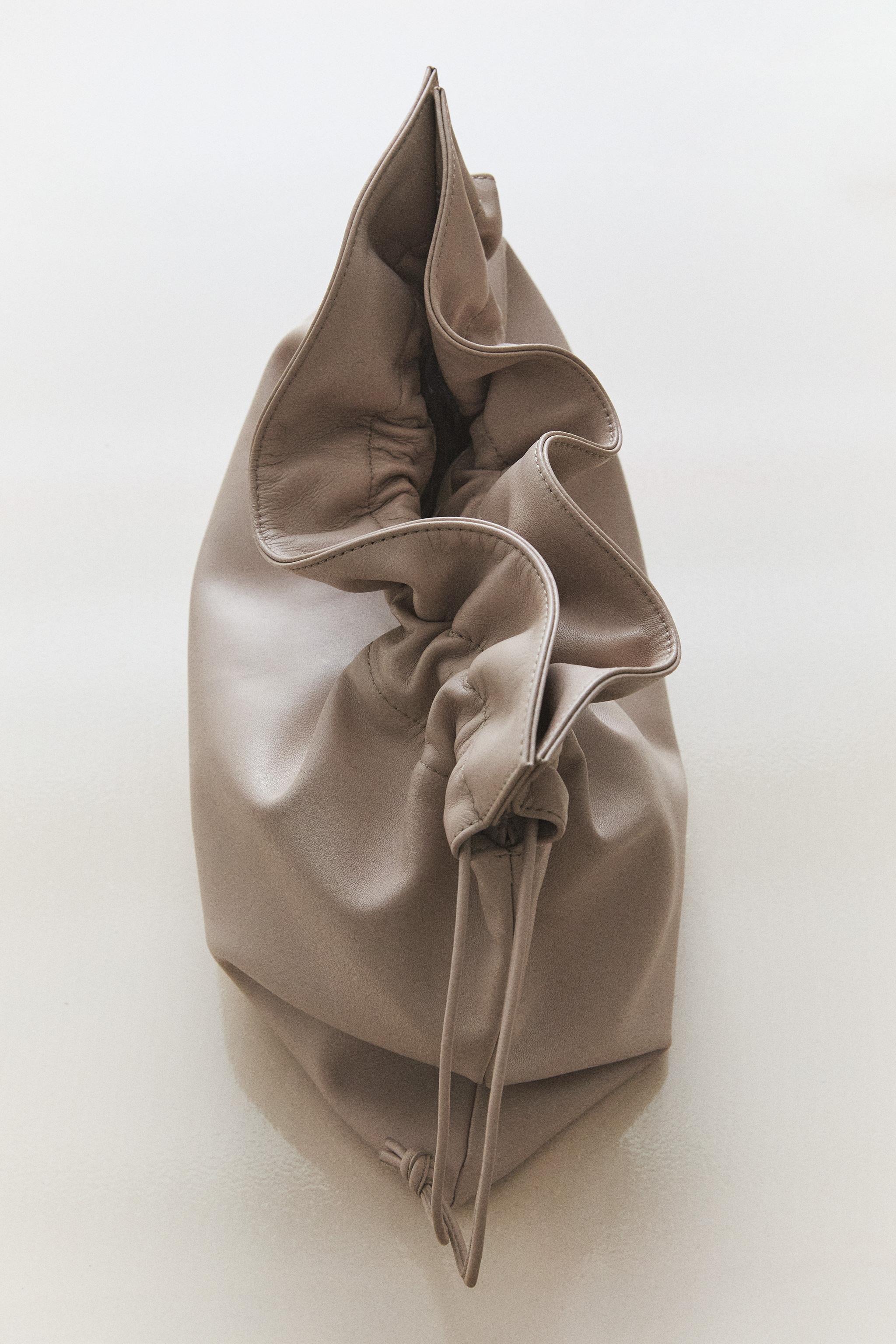 GRAND SAC POCHETTE EN CUIR
