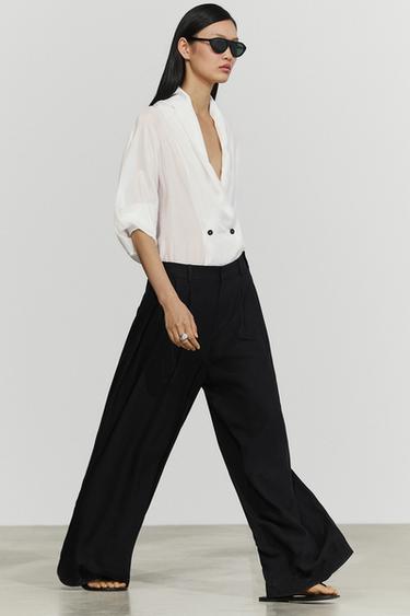 Pantalón fluido pliegues detalle botones - Negro de Zara