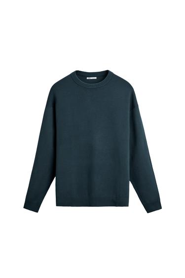 Front view of navy blue sweater with crew neck and long sleeves.