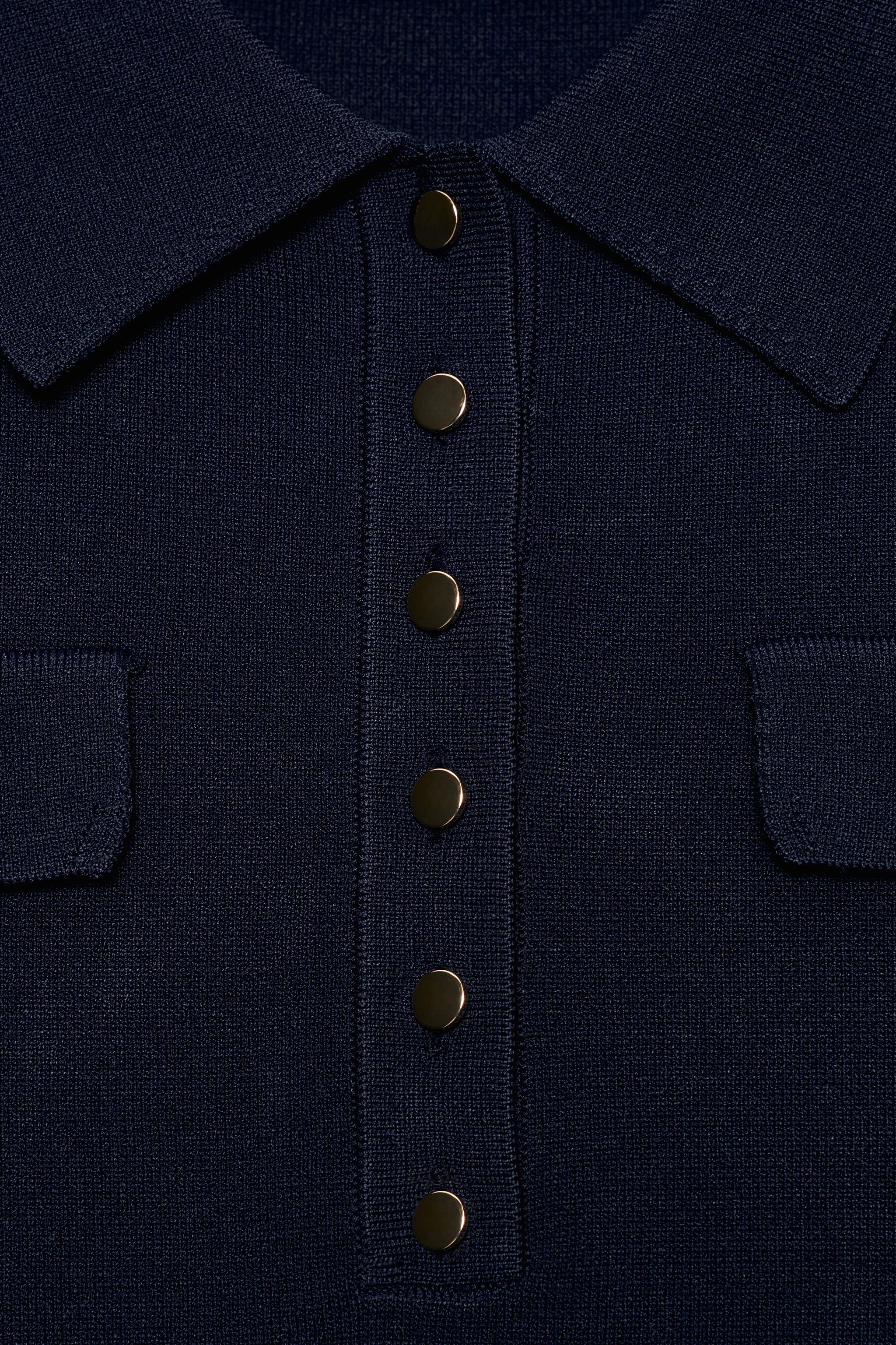POLO EN MAILLE À PATTES DE BOUTONNAGE