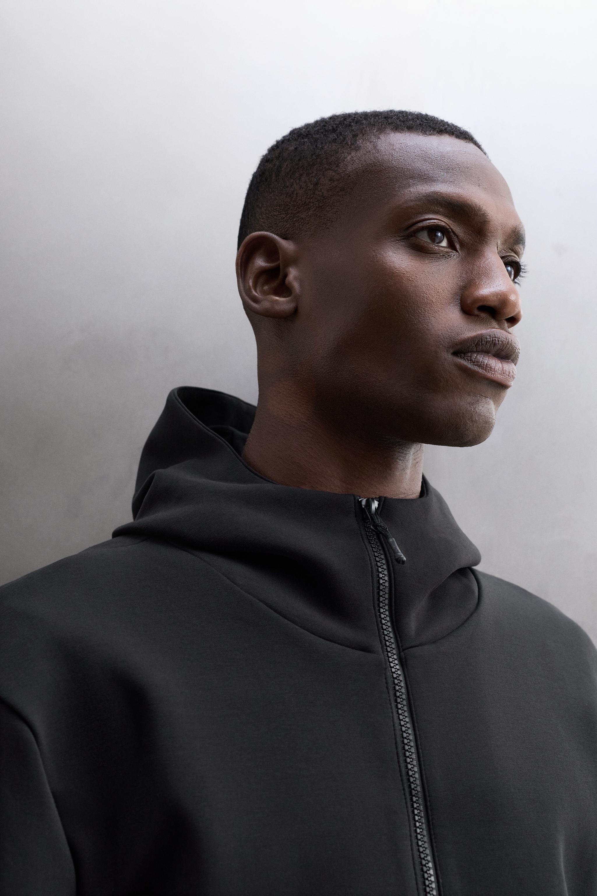 TECHNICAL ZIP-UP HOODIE