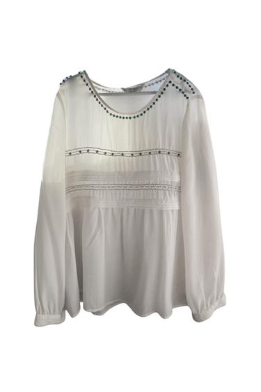 BLUSA BLANCA CON TRAZOS DORADOS