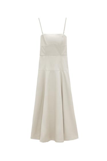 Straight neck midi dress with spaghetti straps. Hidden in-seam zipper closure.
