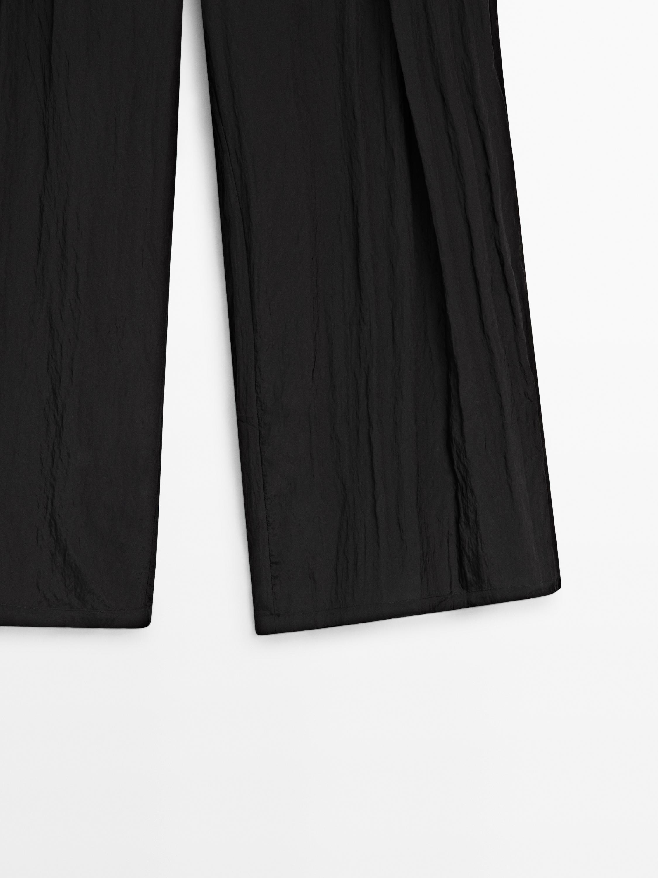 Creased-effect darted technical trousers - Limited Edition - Black