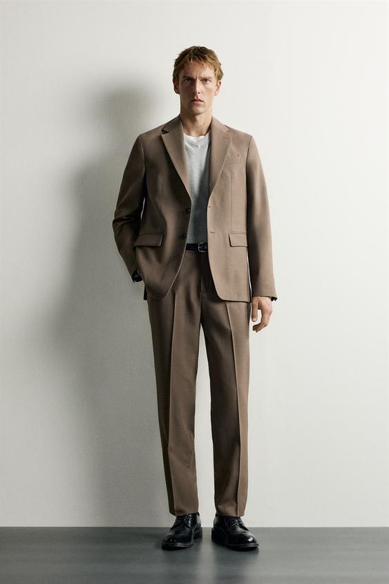 PANTALÓN REGULAR FIT TRAJE - Tostado de Zara - Imagen 0