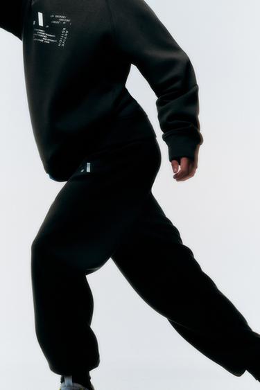 PANTALONS JOGGER SPORTY AMB MISSATGE REFLECTOR - Marró de Zara