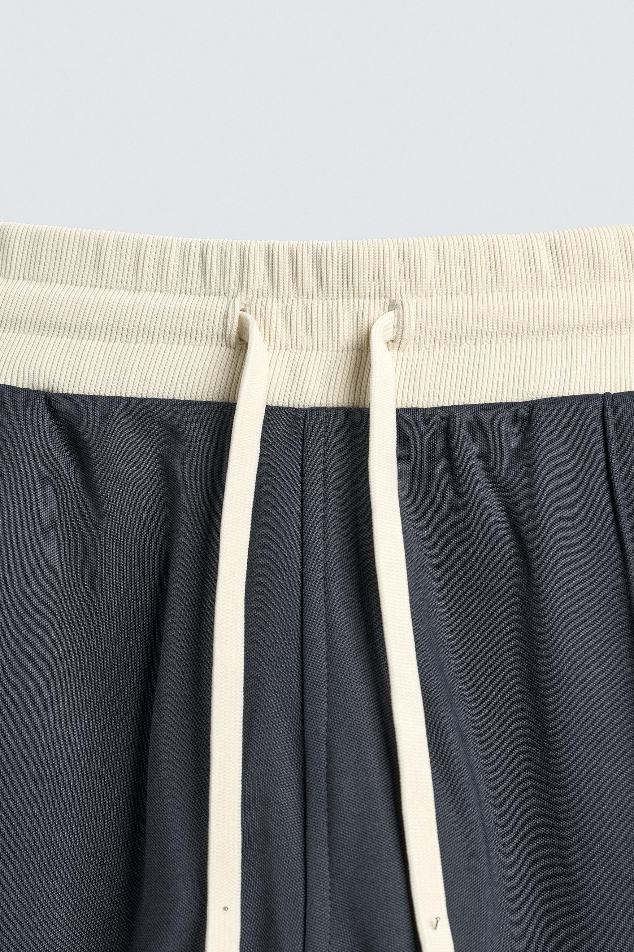 WIDE FIT JOGGER PANTS WITH STRIPES