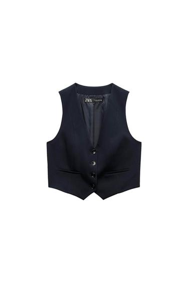 Sleeveless black vest with front buttons and pockets, visible inner label with the "ZARA" brand. White background.