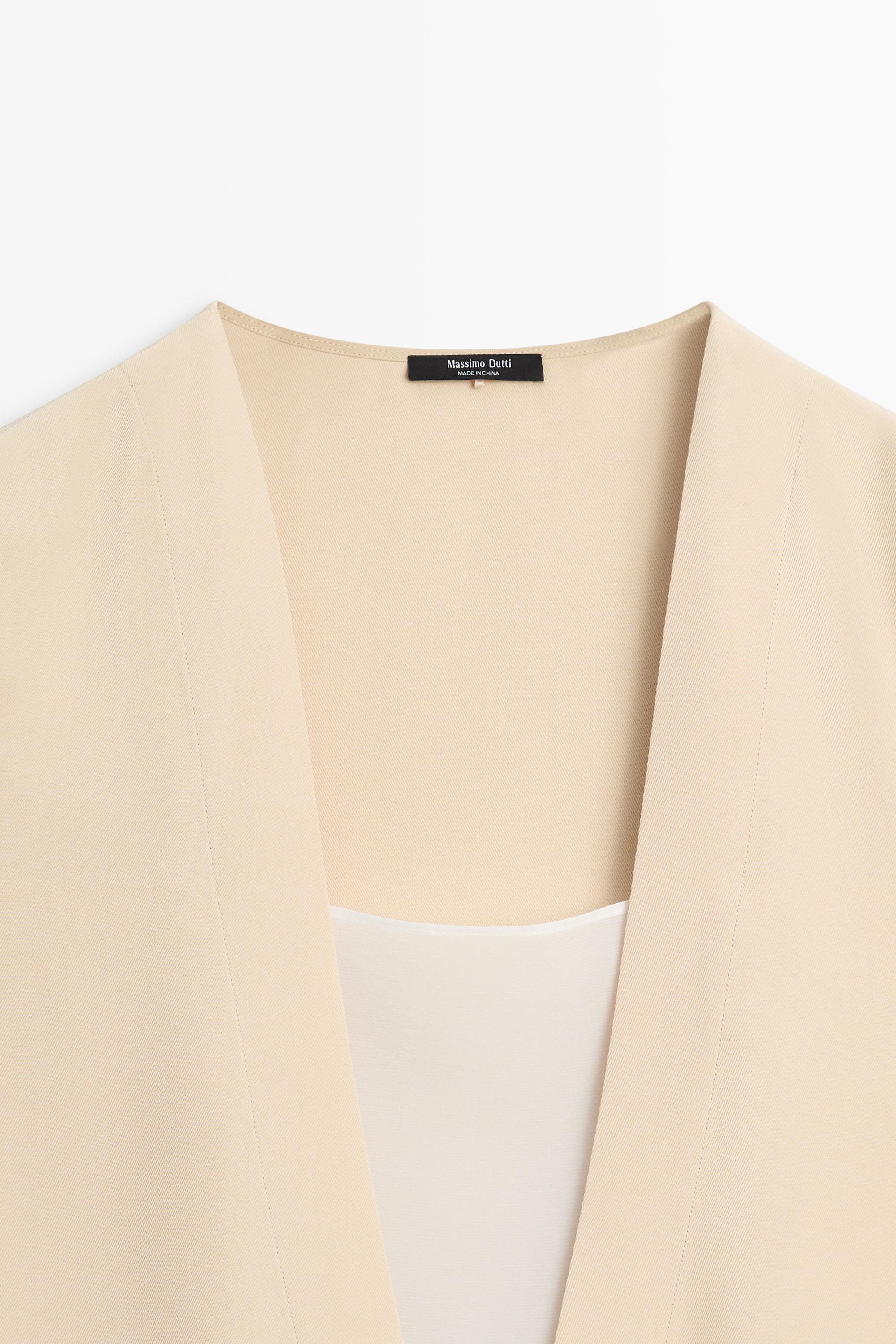 Flowing double-layer top with contrast detail