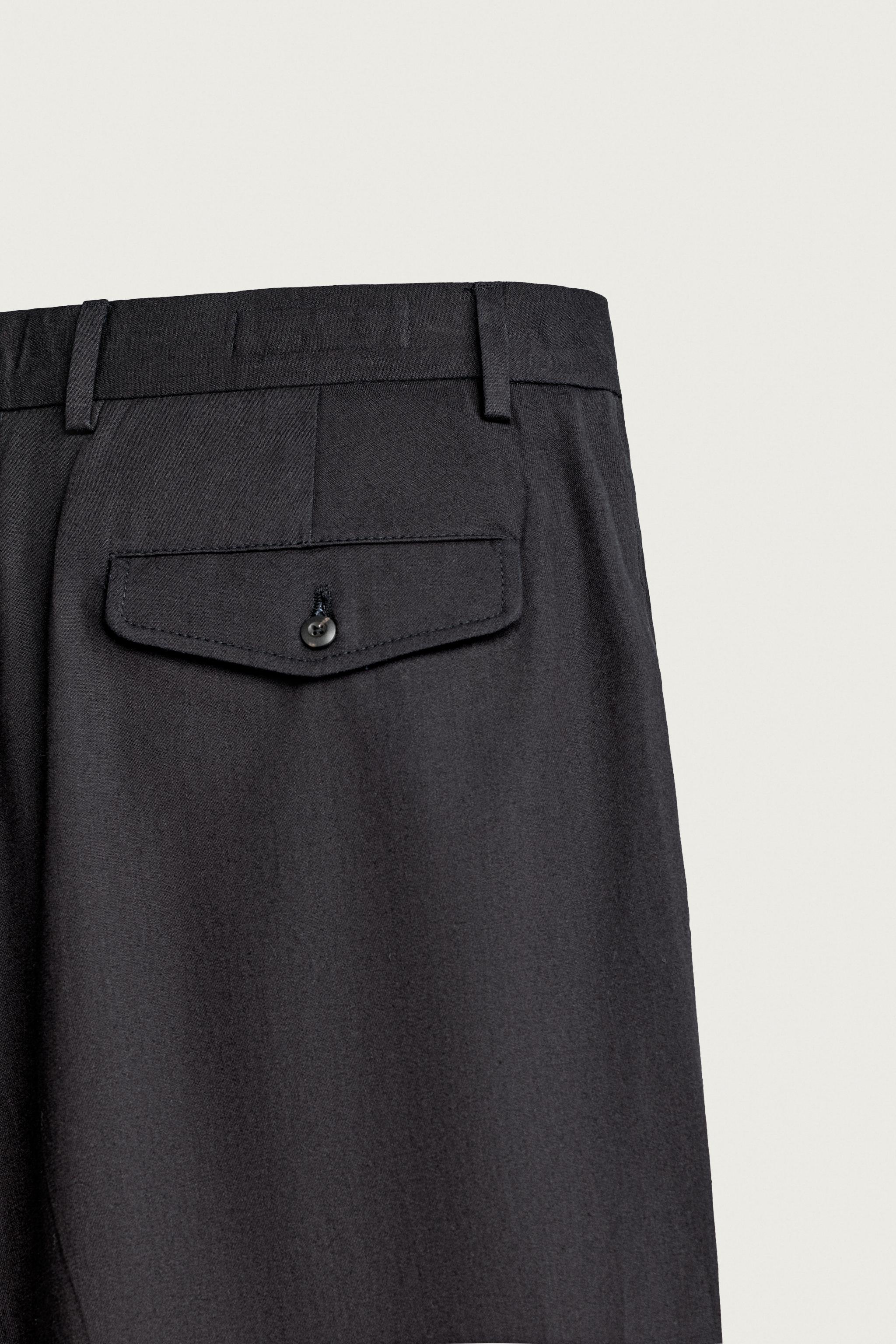 RELAXED-FIT PLEATED TROUSERS