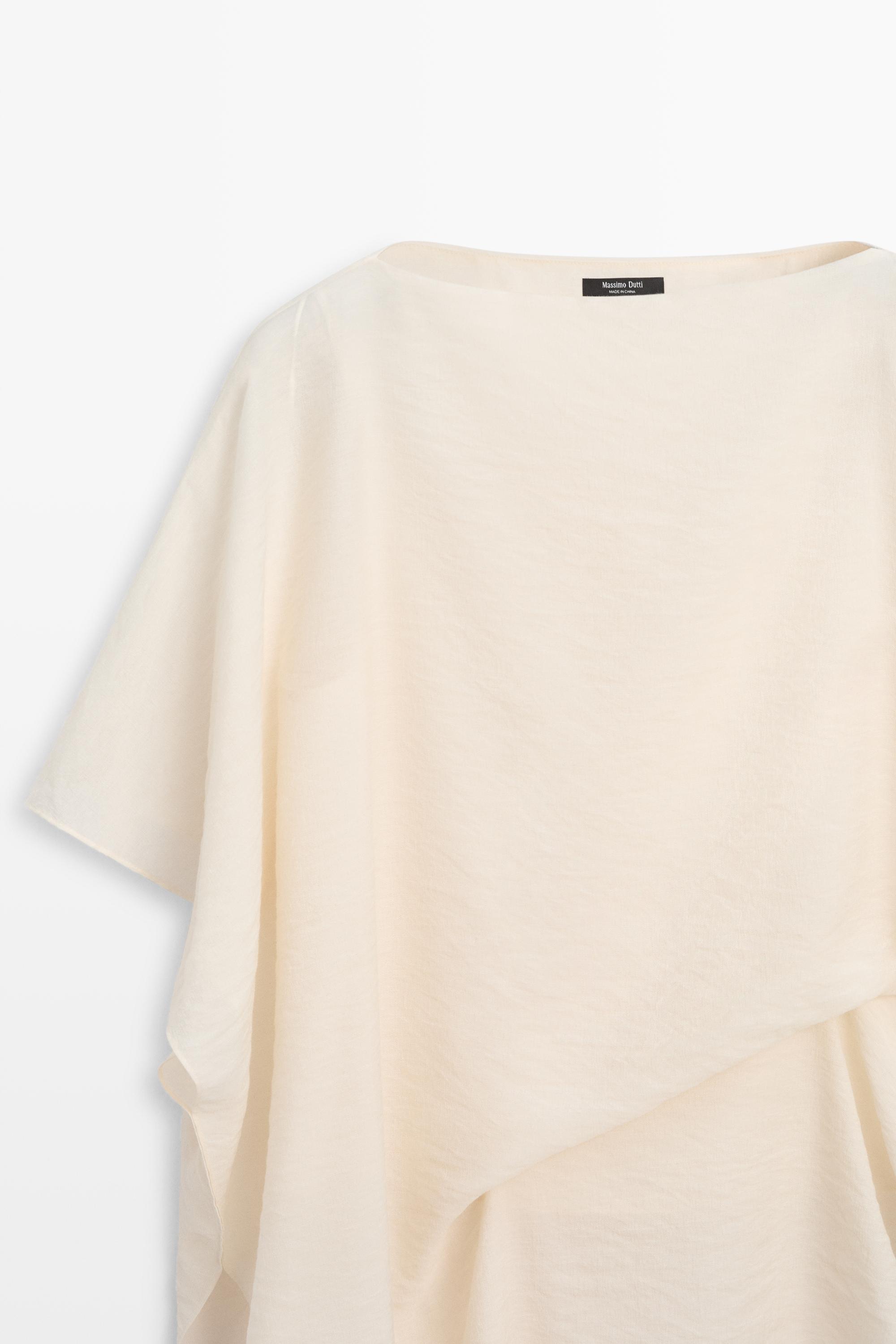 Blouse fluide asymétrique style cape