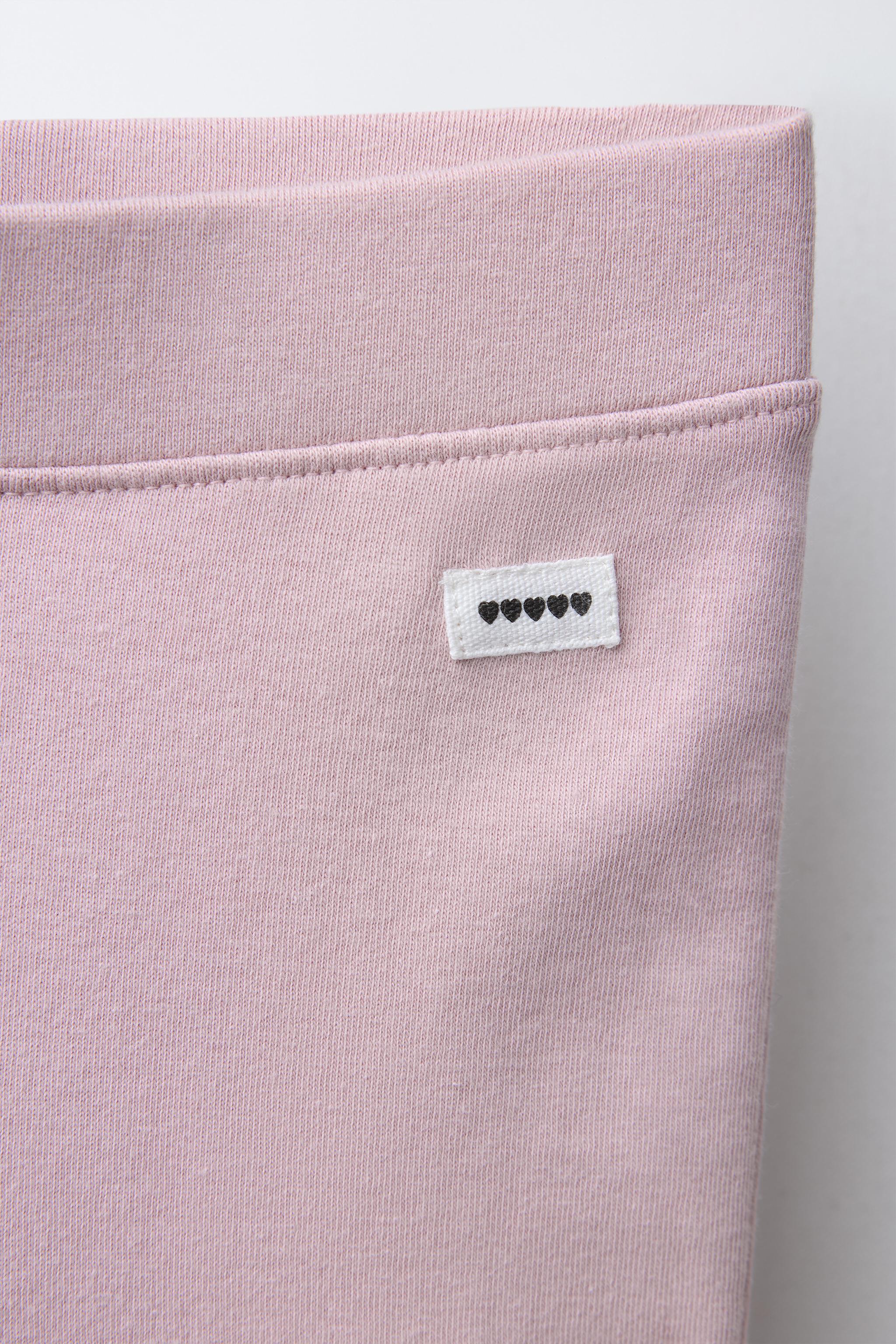 LEGGING FLARE INTERLOCK À ÉTIQUETTE