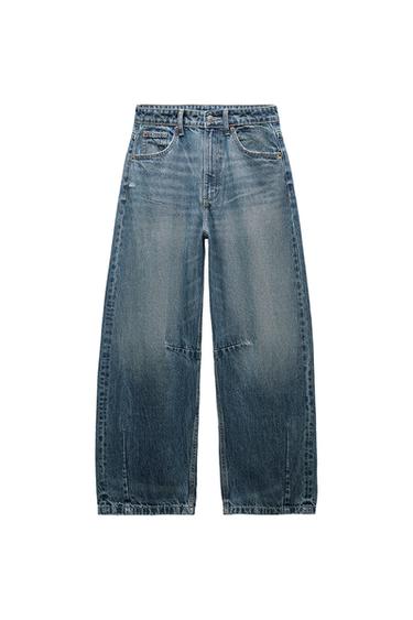 Front view of blue denim jeans with front pockets and belt loops.