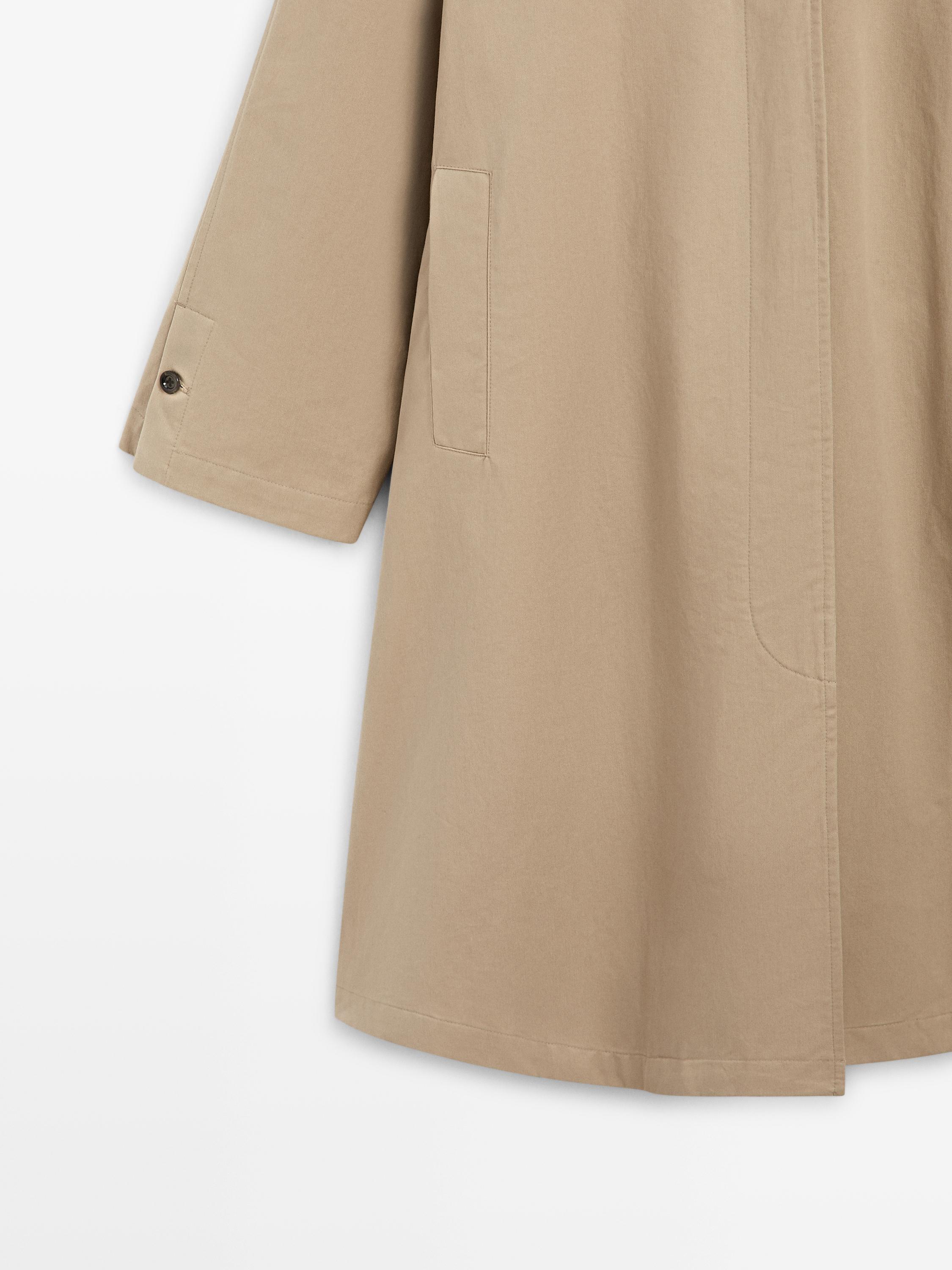 Cape trench coat with detachable hood