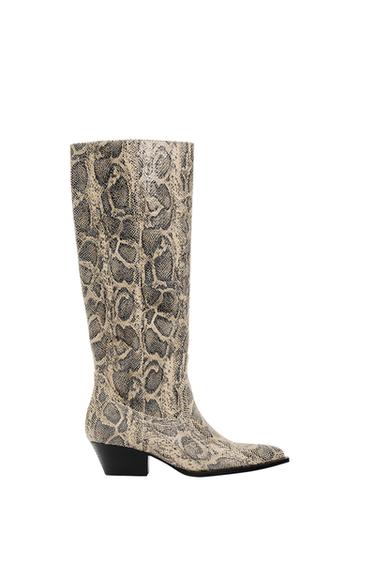 Side view of a high boot with snake print and a low heel.
