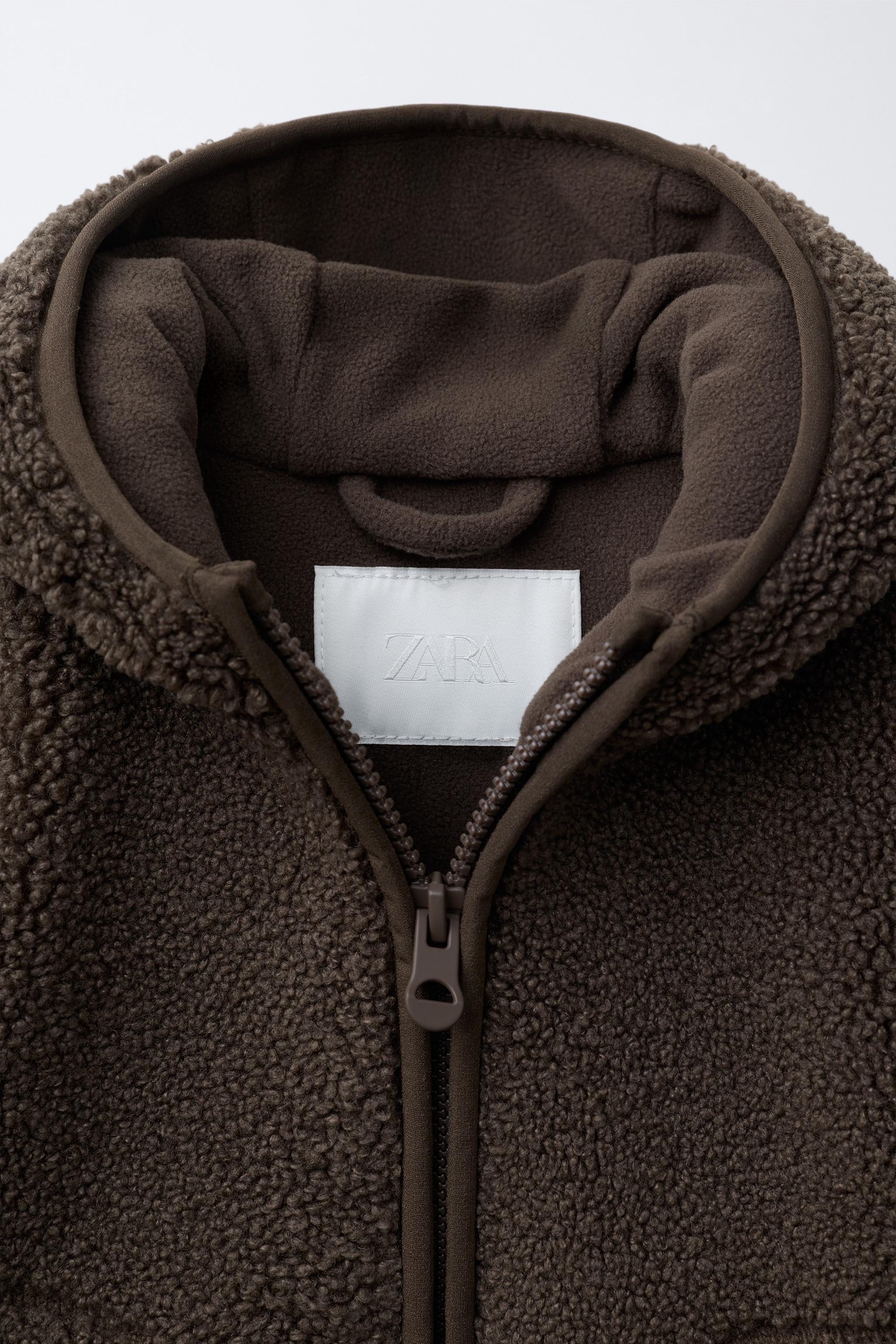 VESTE EFFET MOUTON À CAPUCHE