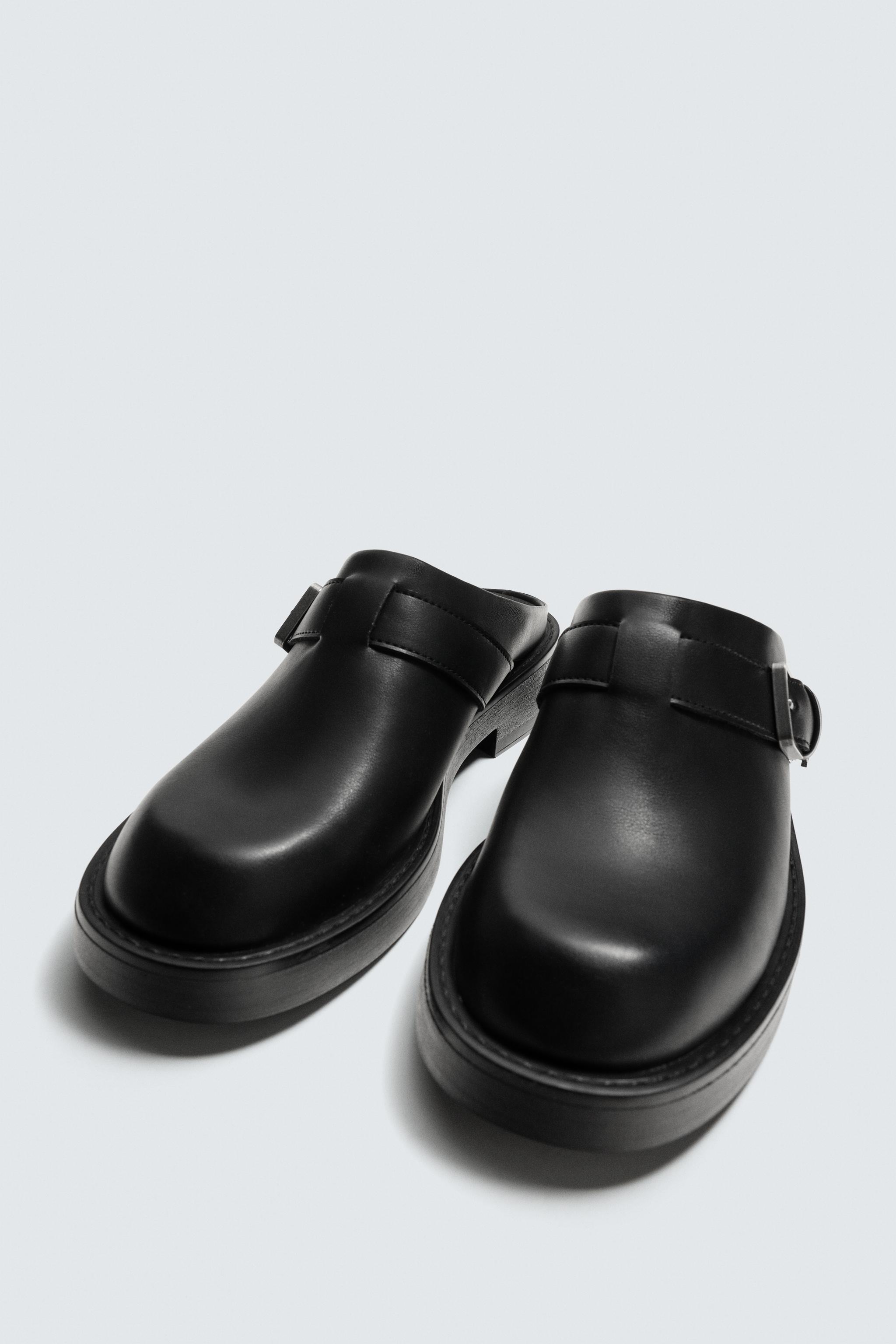 BUCKLED CLOGS