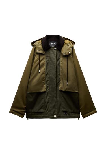 Front view of green jacket with hood, large front pockets, and drawstrings.