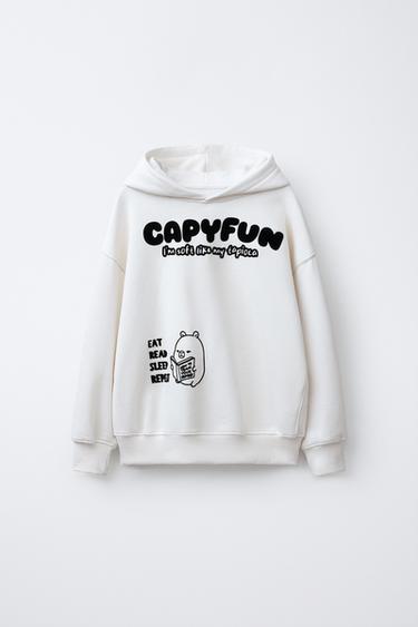 SWEAT À CAPUCHE CAPIBARA CAPYFUN © - Écru de Zara