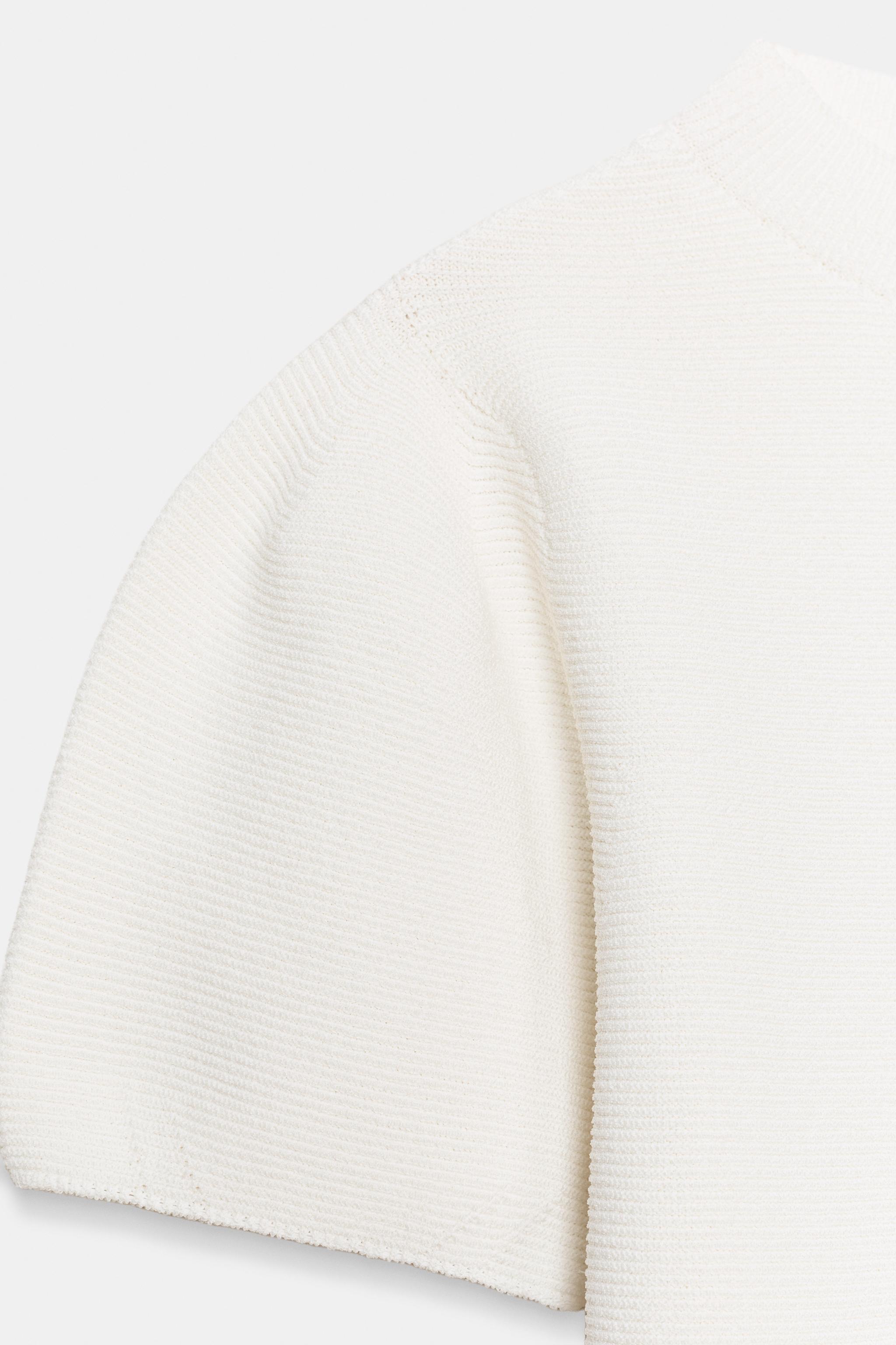 TOP EN MAILLE À MANCHES BOUFFANTES
