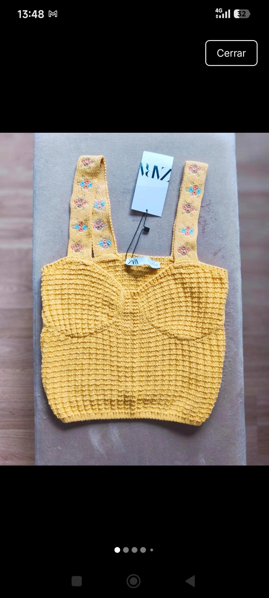 Yellow knit top with embroidered flowers on the straps. ZARA label. Interface text: 13:48 M, 4G, 32, Close.