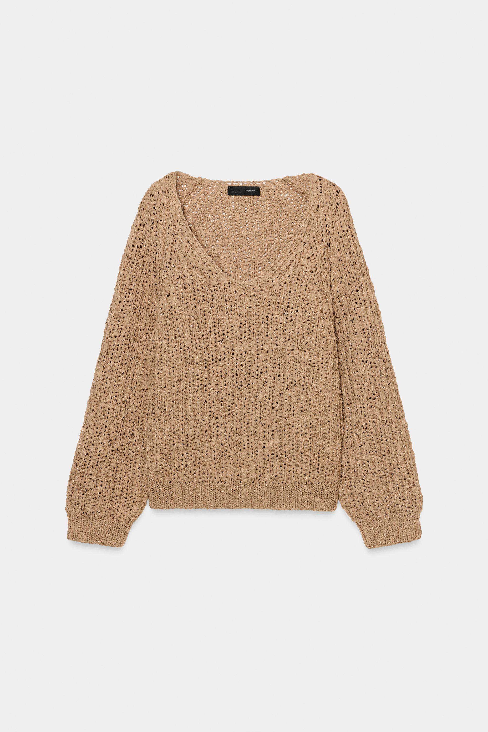PULL EN MAILLE AVEC BANDE ENTRELACÉE