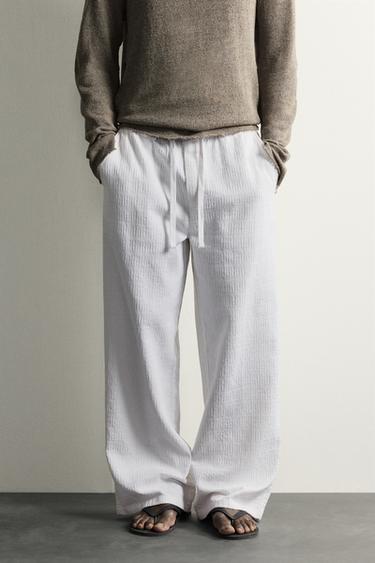 بنطلون RELAXED FIT من الجاكار المغسول - أبيض الخاص بـ Zara