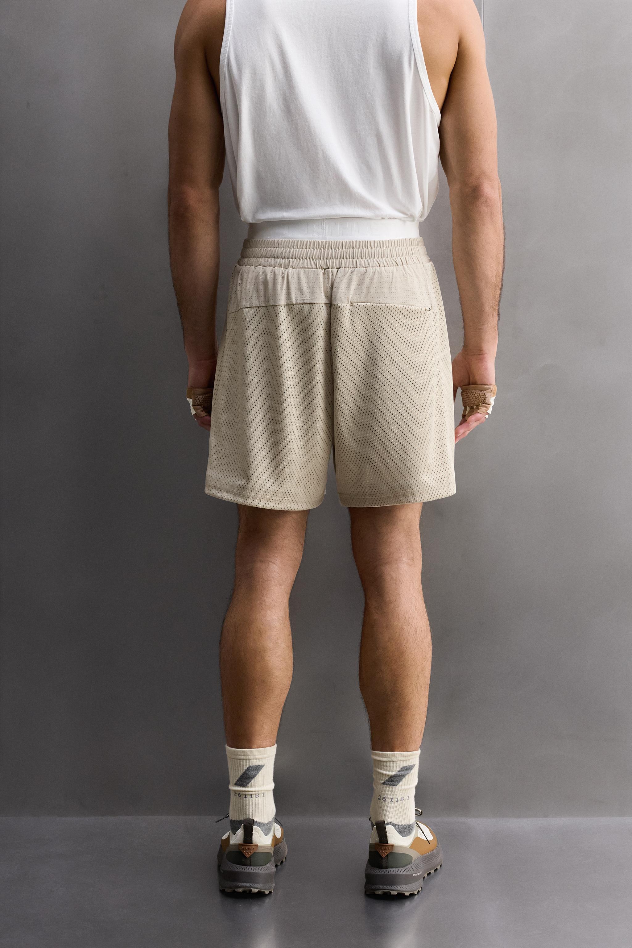 COMBINED PERFORATED SHORTS