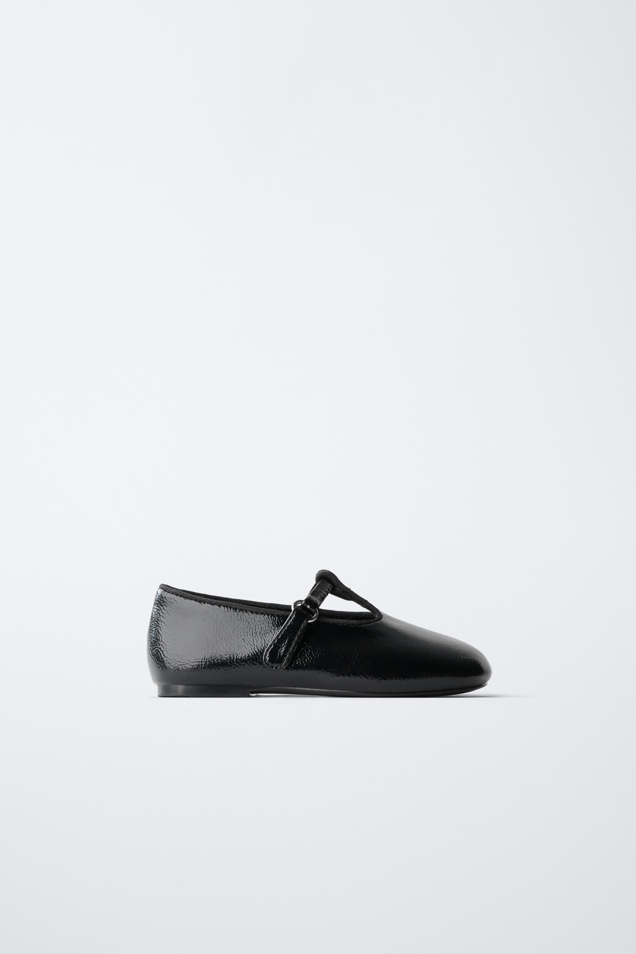 PATENT BUCKLE BALLET FLATS — Black