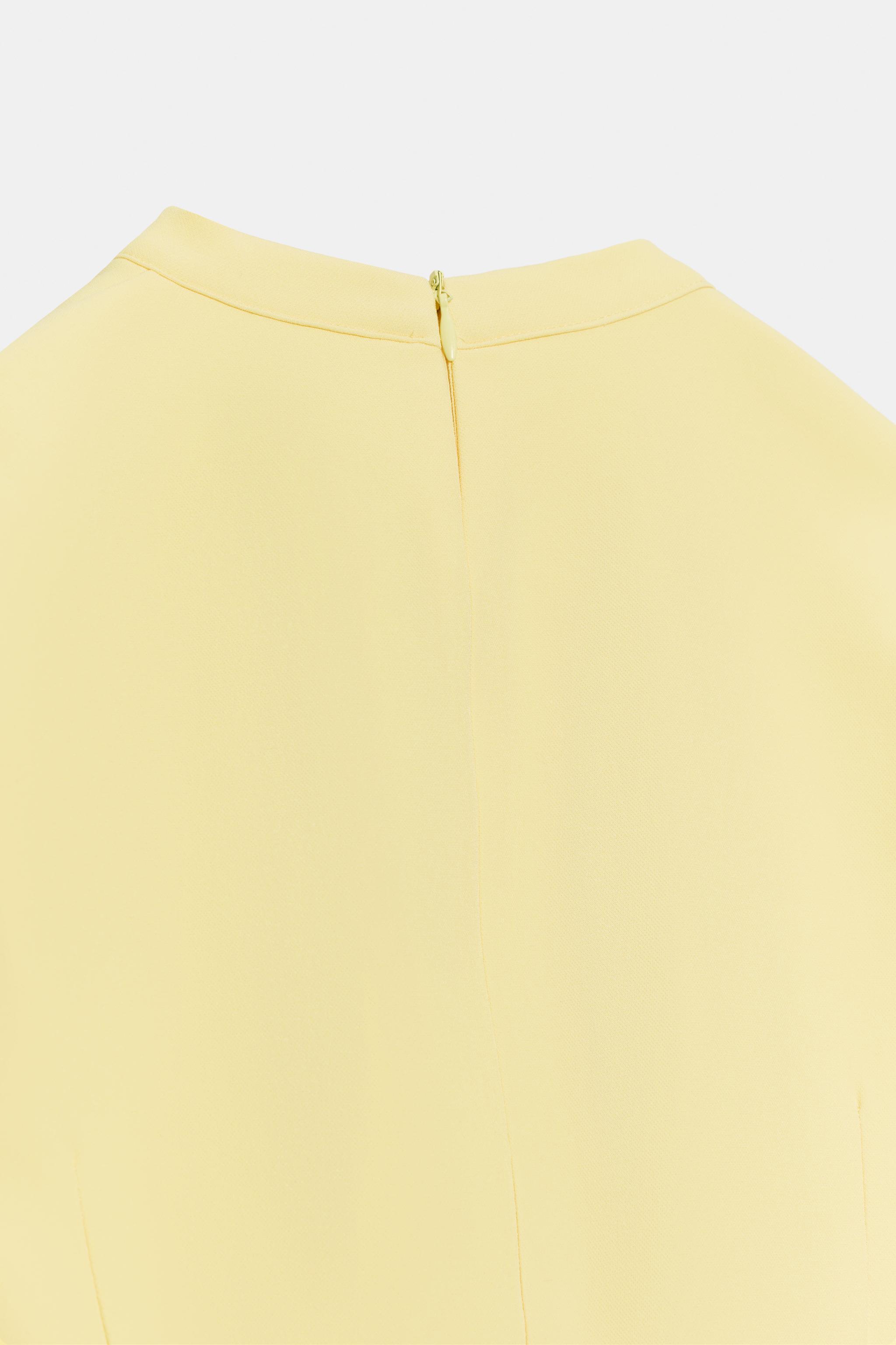 ROBE COURTE À NŒUD POIS