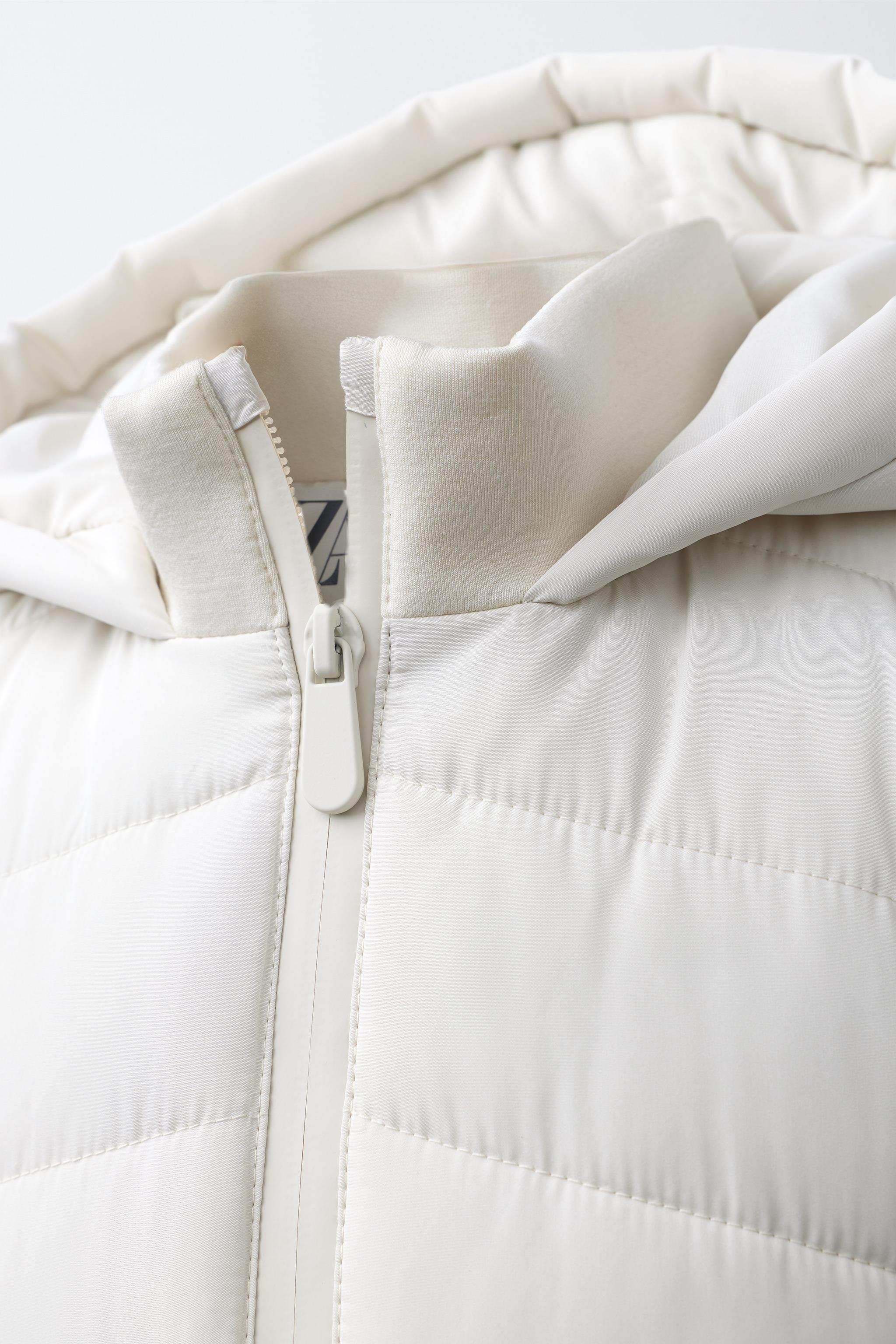 PUFFER JACKET WITH NEOPRENE EFFECT SLEEVES