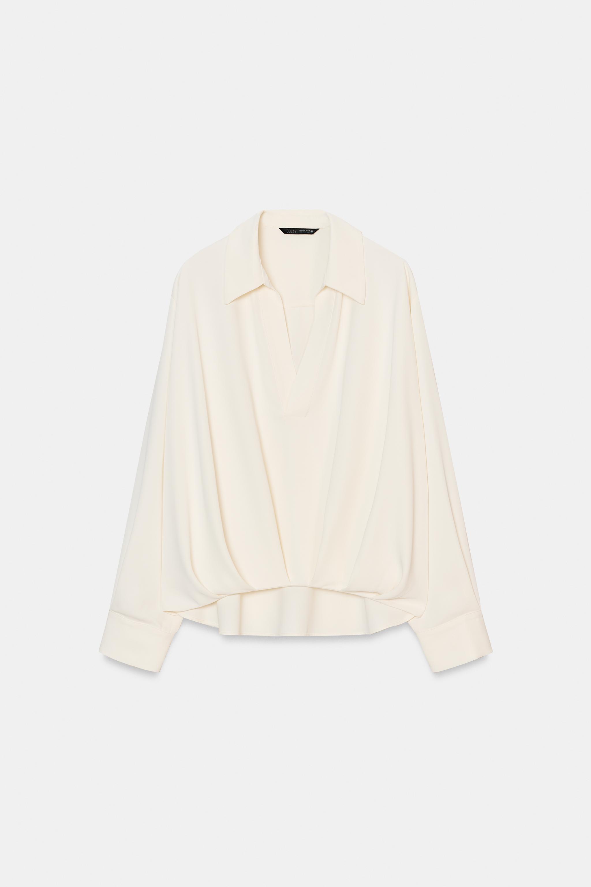 CHEMISE À PLIS ET BAS ASYMÉTRIQUE