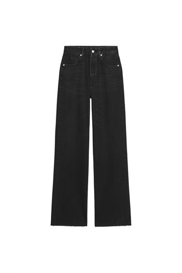 Front view of high-waisted, wide-leg, five-pocket black jeans. Front zip fly and metal button closure.