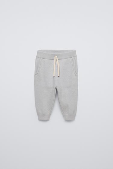 Zara Jogger pants with elastic waistband and front adjustable drawstring. Front pockets. Cuffed hems. - Light gray