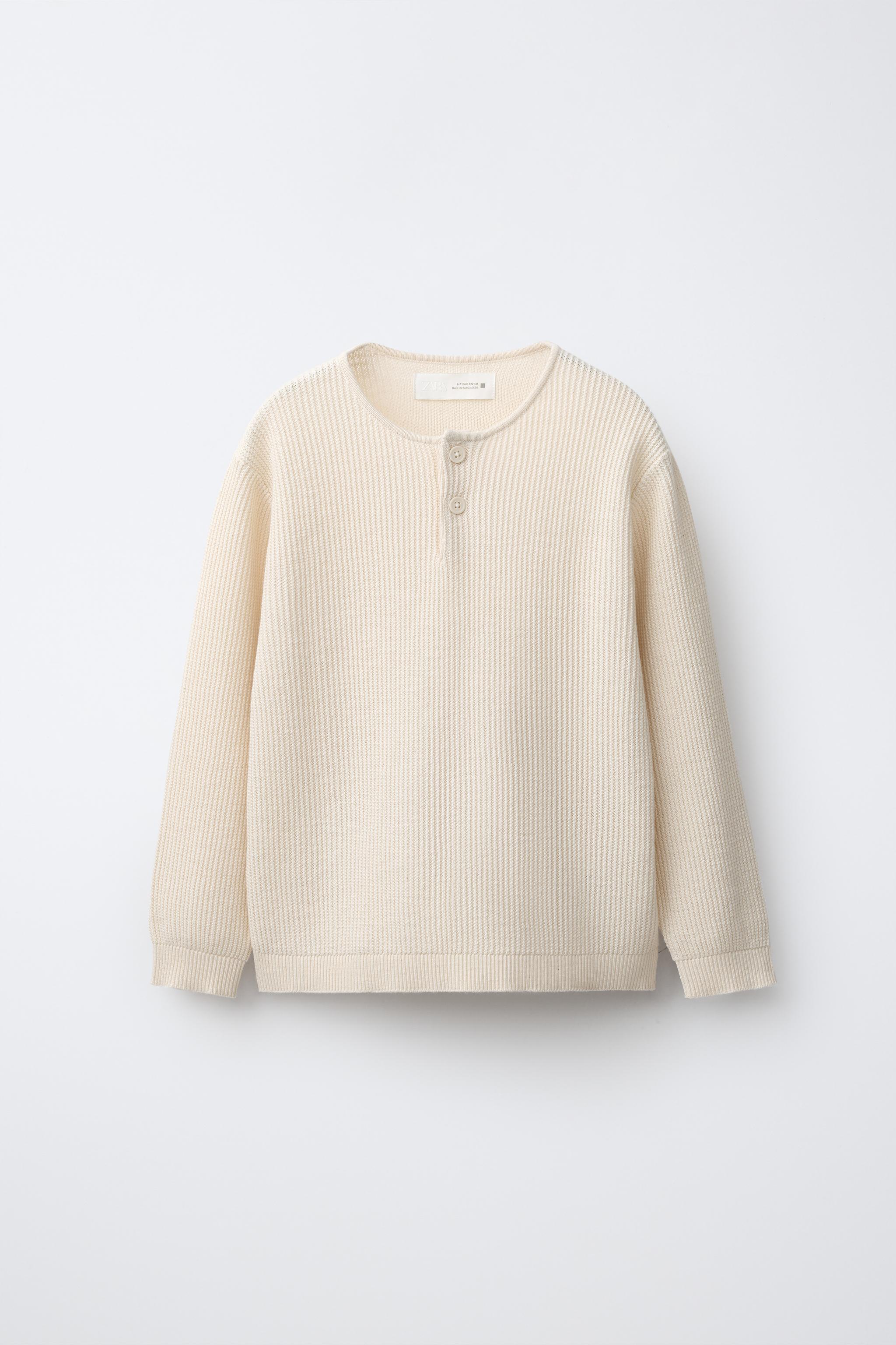 PULL EN MAILLE À COL MONTANT