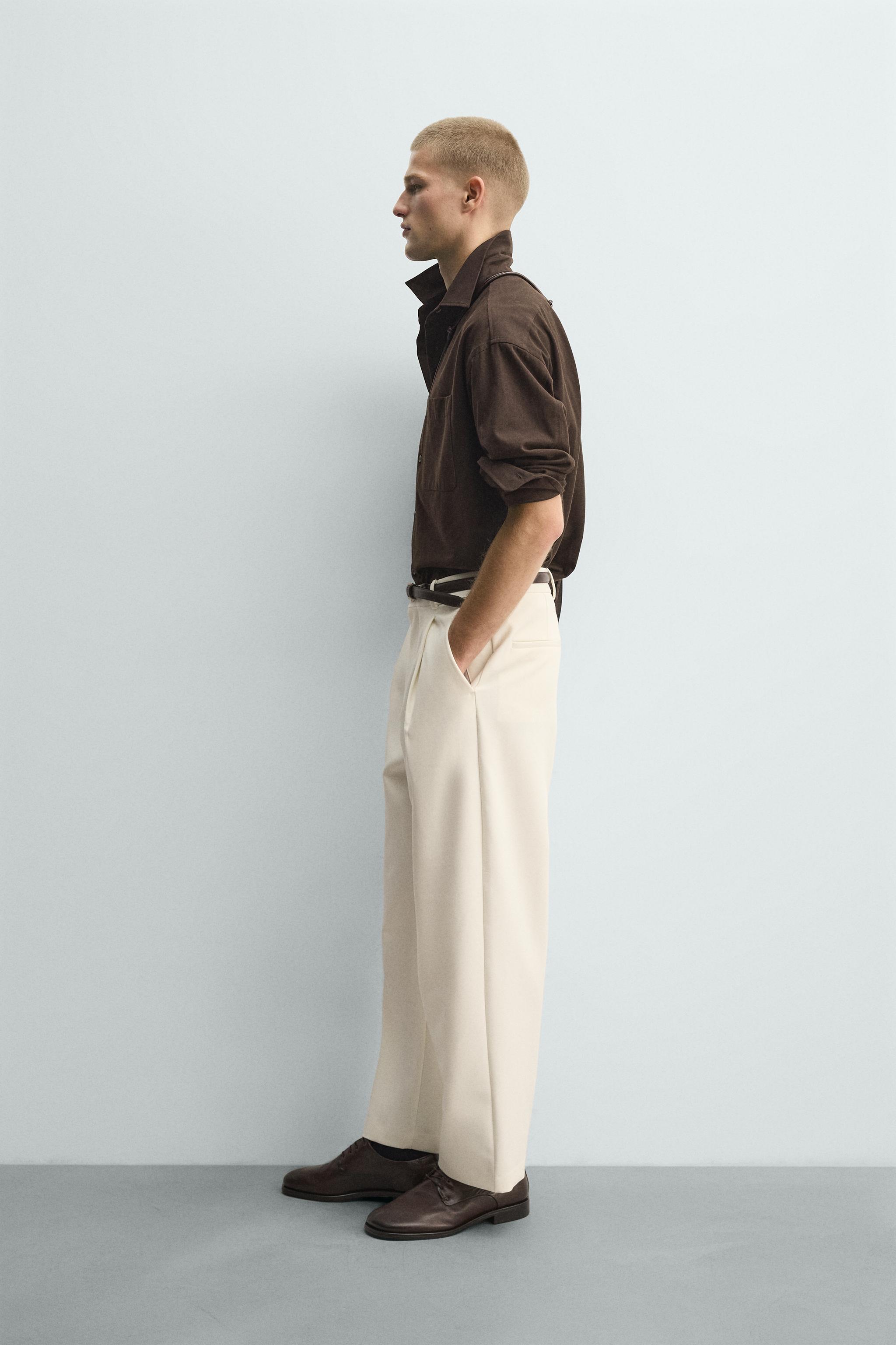RELAXED FIT PLEATED PANTS