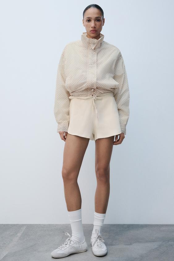 CHAQUETA BAJO AJUSTABLE LUNARES - rosa claro de Zara - Imagen 0