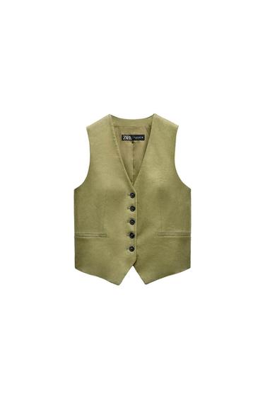 Olive green vest with black buttons and front pockets. Visible interior label with the text "ZARA". White background.