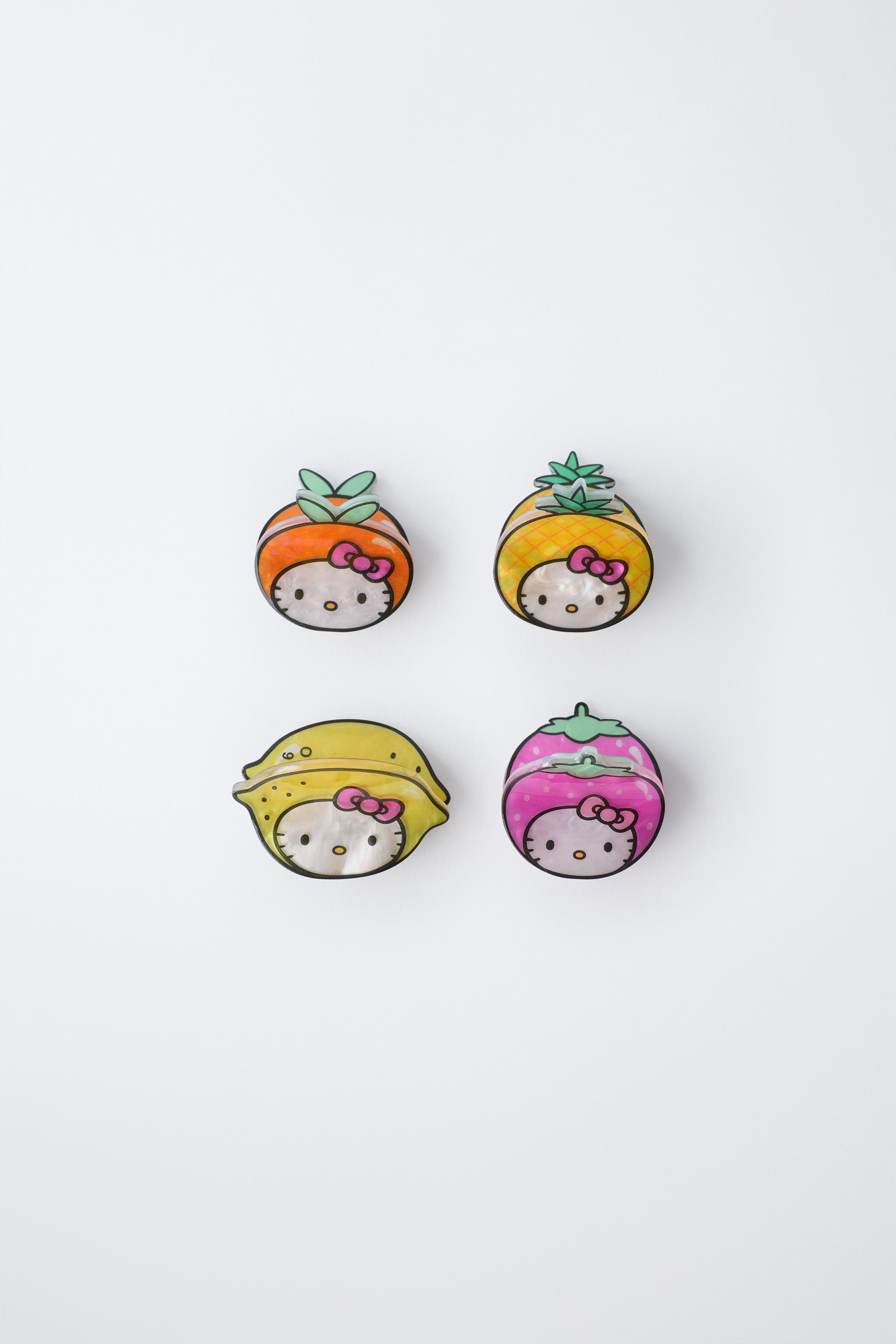 LOT DE QUATRE PINCES FRUITS HELLO KITTY © SANRIO