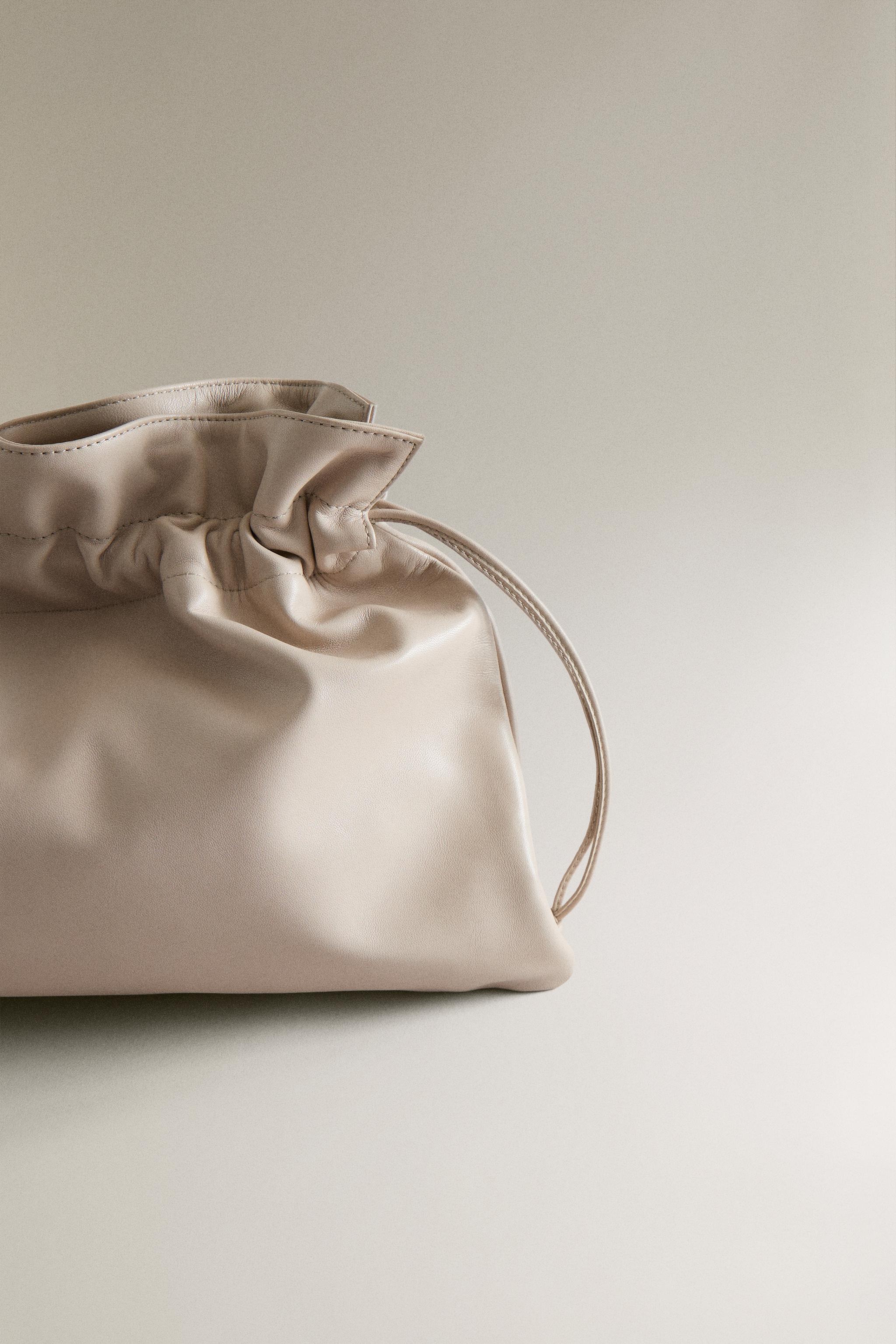 GRAND SAC POCHETTE EN CUIR