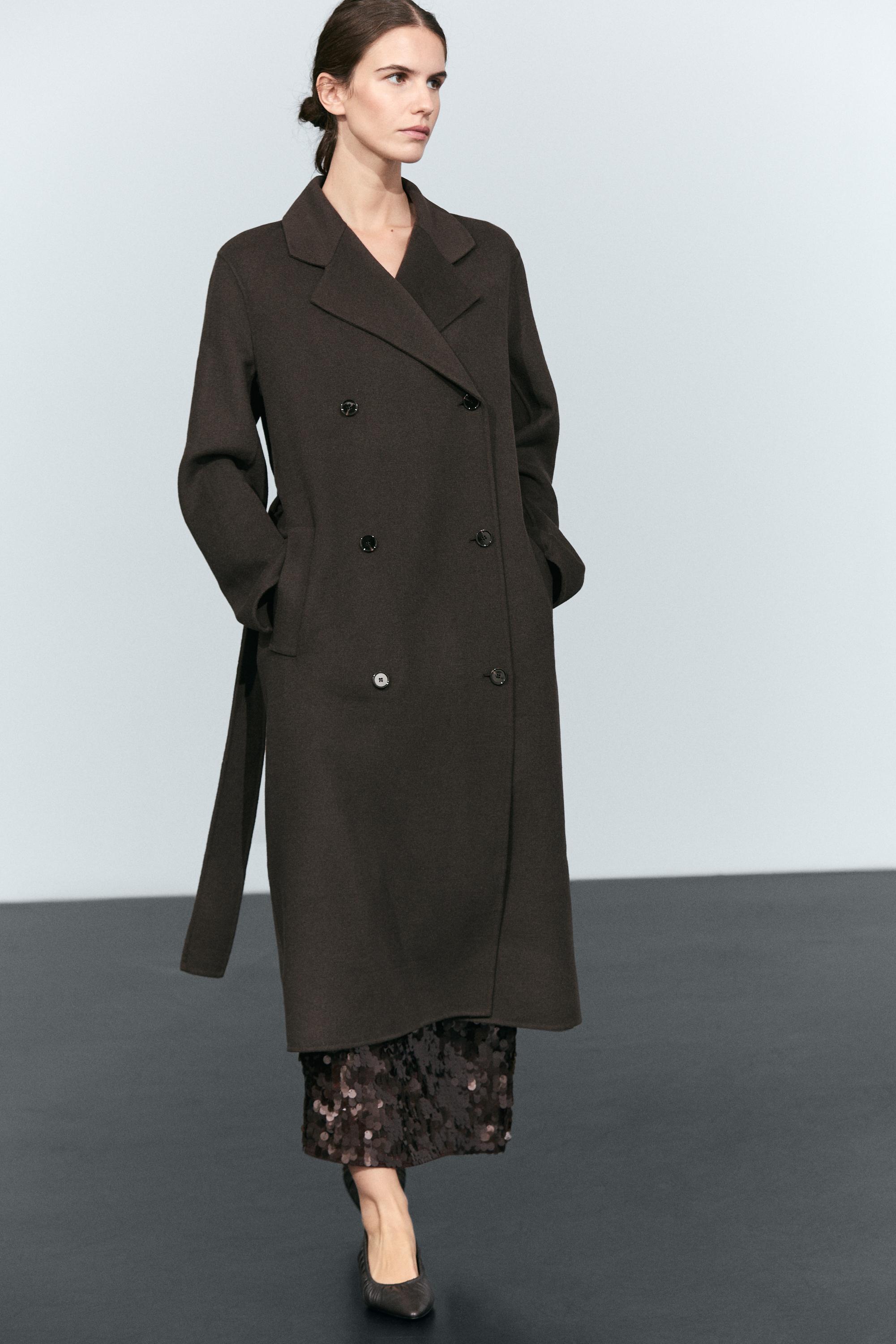 Manteau long croisé détail ceinture