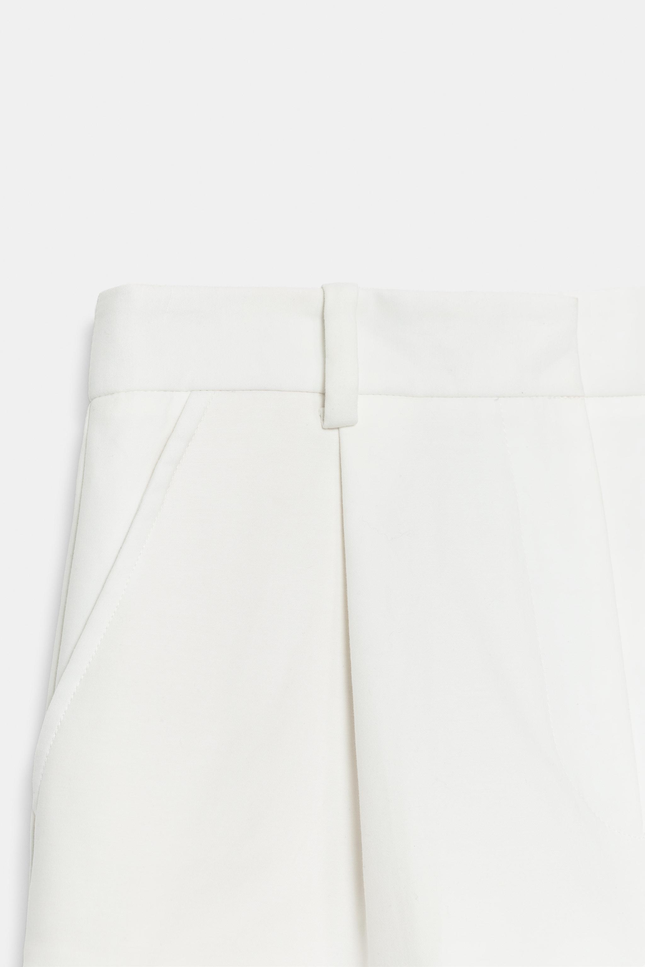 HIGH-WAISTED PLEATED SHORTS