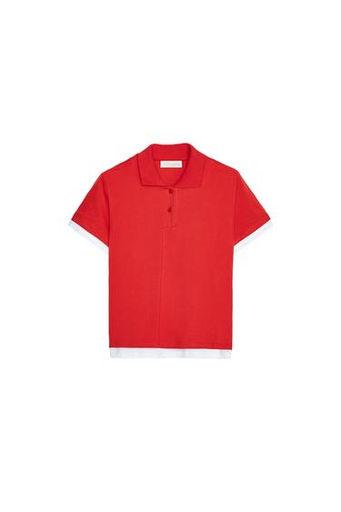 Front view of a red polo shirt with collar and buttons, sleeves and bottom hem with white trim.