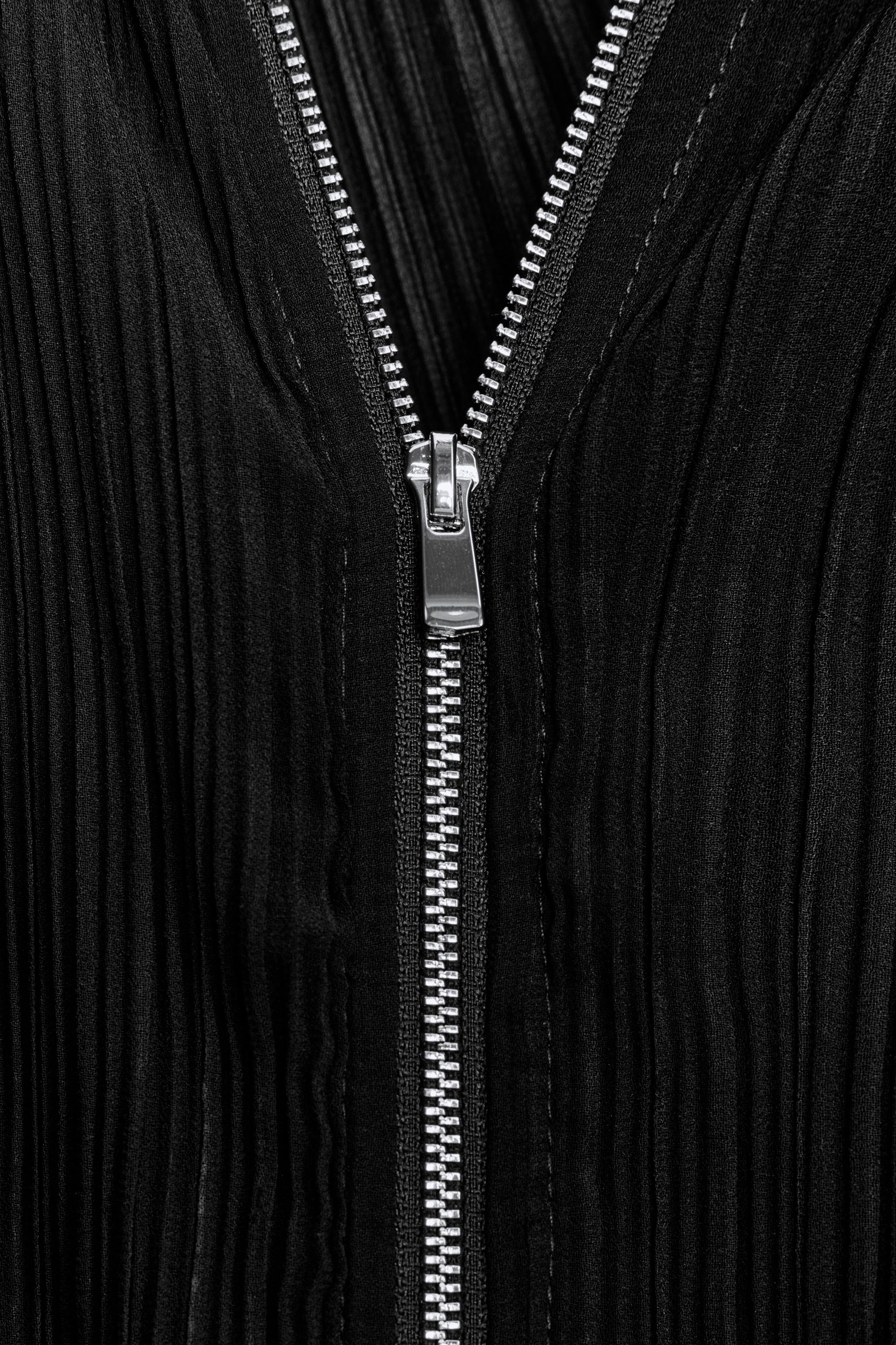 VESTE PLISSÉE À VOLANTS