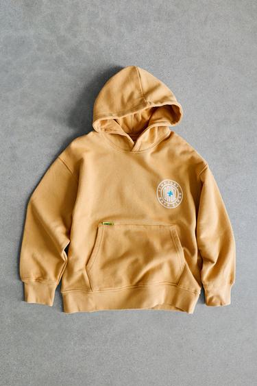 LOGO PRINT HOODIE — Mustard 1